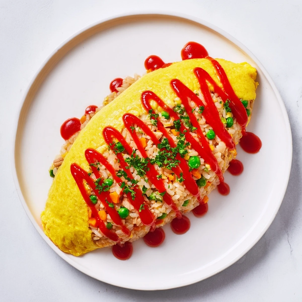 Golden omelet wrapped around savory ketchup fried rice in this classic Japanese omurice dish