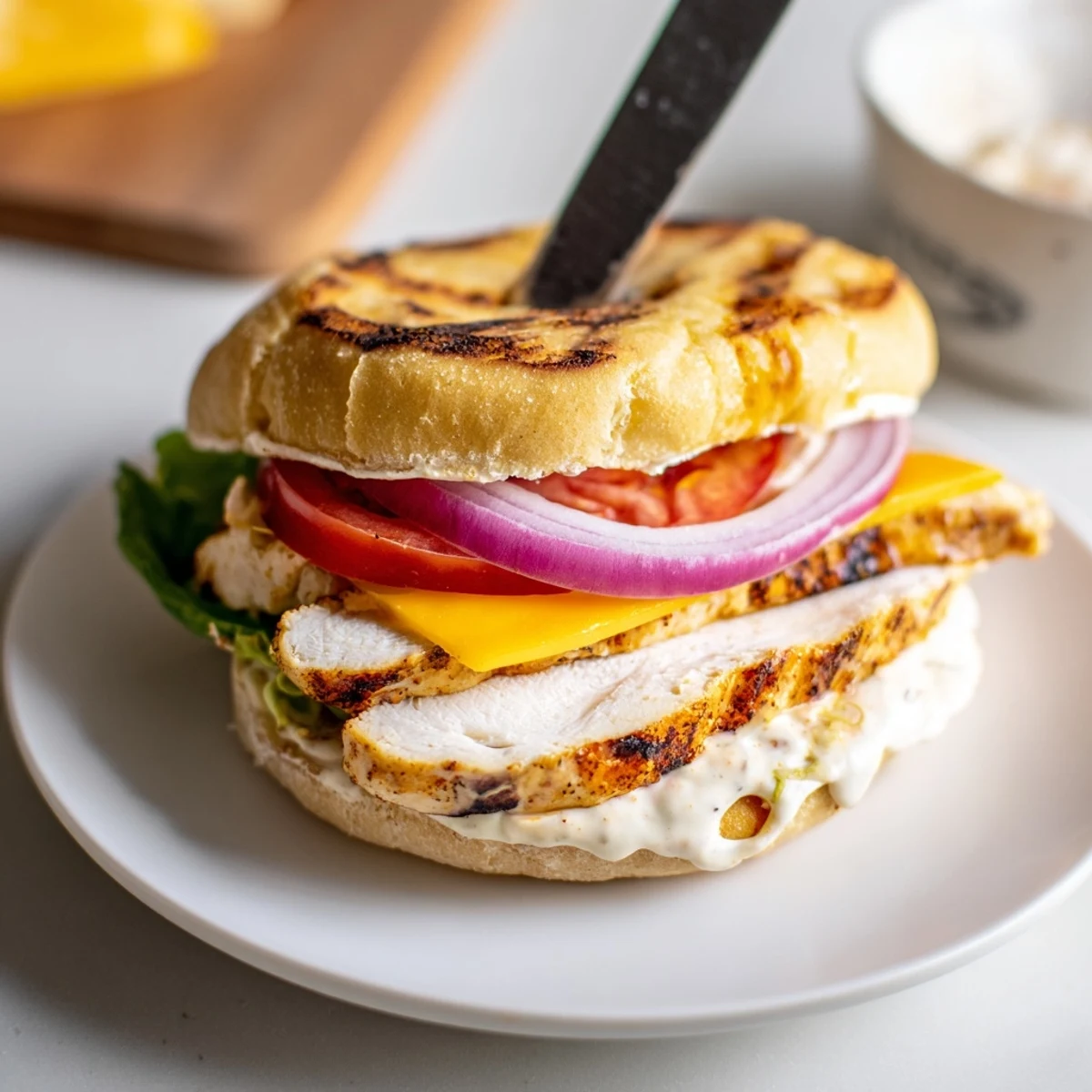 Spicy Chicken Sandwich With Creamy Sauce on toasted bun, juicy chicken, tangy kick
