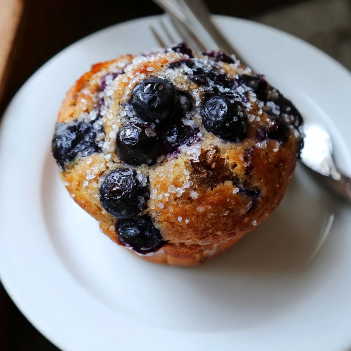 Fresh baked Blueberry Banana Muffins served with butter and steaming coffee