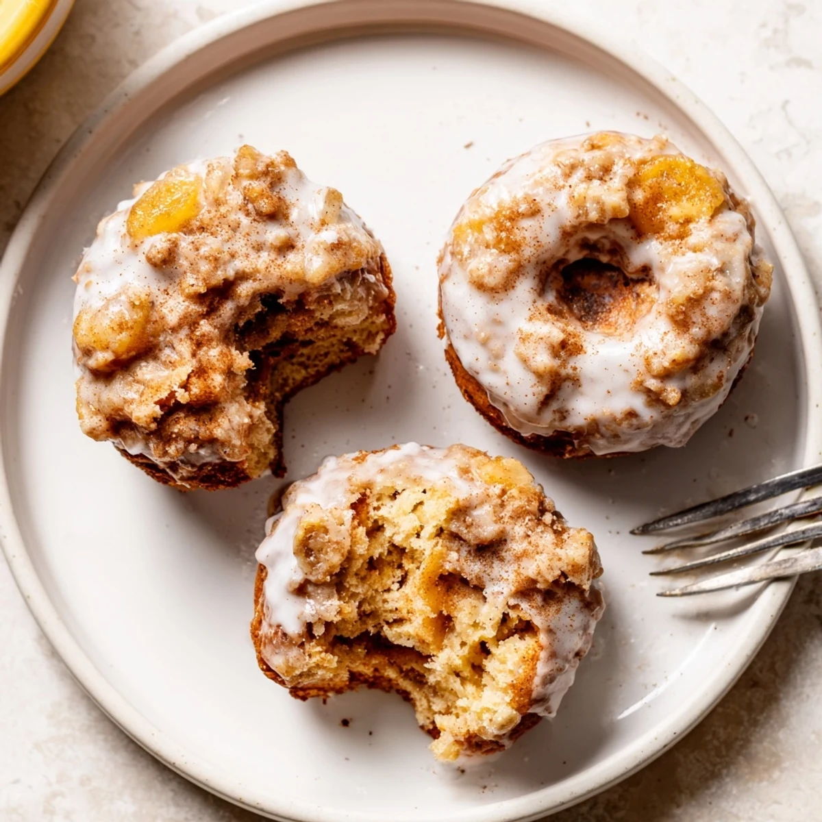 Glazed Banana Donuts cooling on a rack, tender texture and sweet glaze.