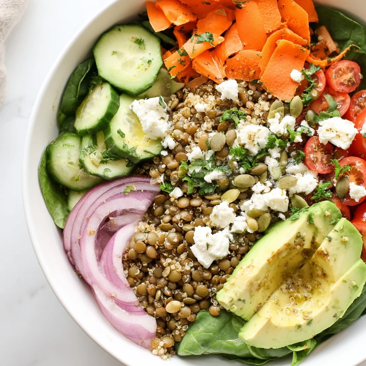 Hearty lentil grain bowl arranged on a wooden table with vibrant toppings
