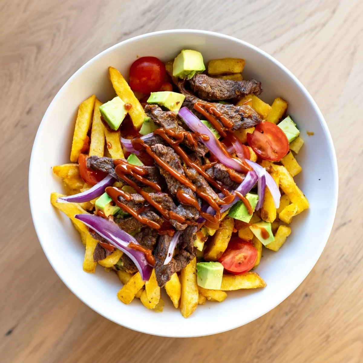 A savory steak strips crispy fries bowl recipe loaded with baked fries, marinated sirloin, cherry tomatoes, and zesty mayonnaise dressing.