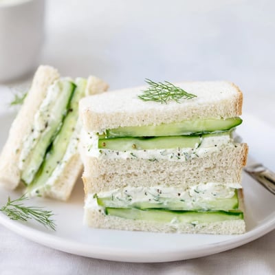 Classic Cucumber Sandwiches layered on soft white bread with peppered cream cheese for tea